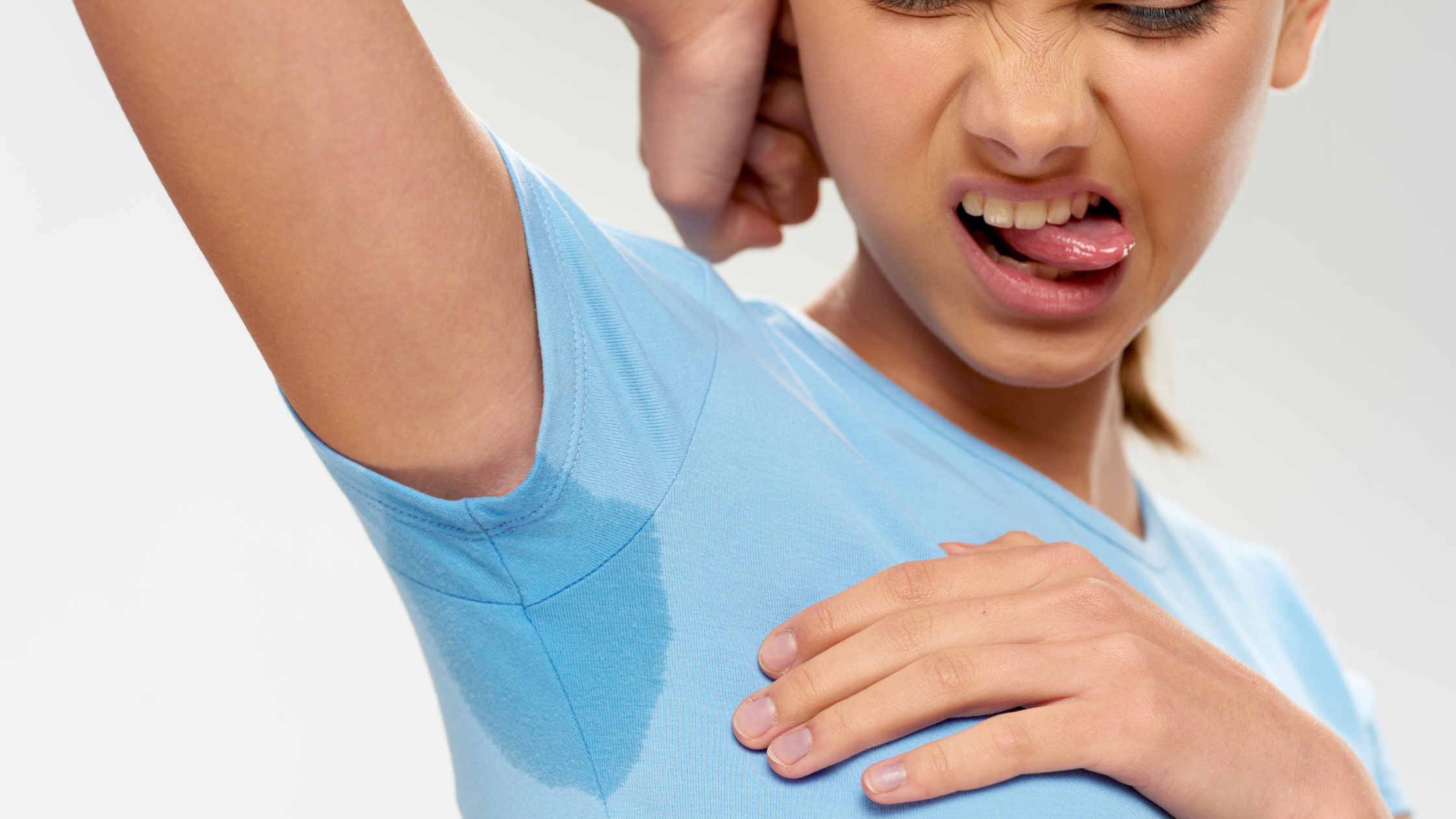 Woman with a sweaty armpit